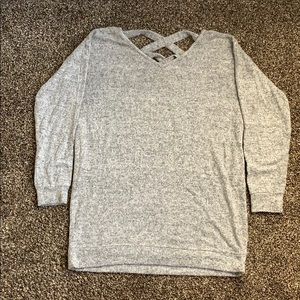 Gray tunic sweater with open back detail